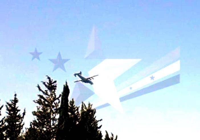 Transport airplane An-22 is seen over the base Hamim