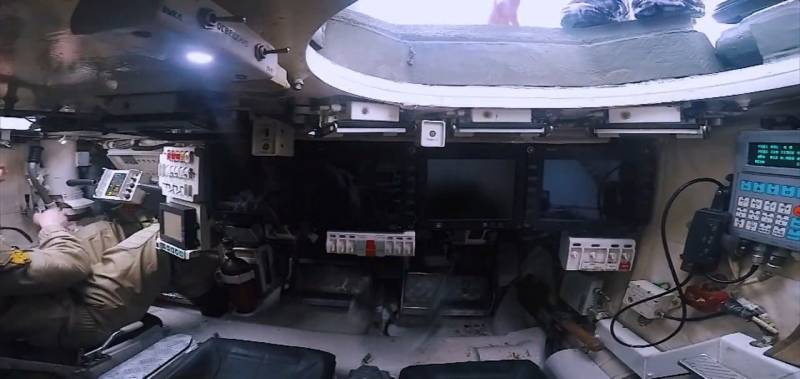 Discusses photos of an inhabited capsule T-14 